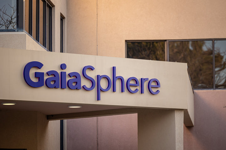 Focusing on the facade of a building where GaiaSphere is written as a signage.