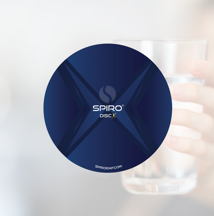 A blue disc with SPIRO Disc printed in the middle with a very faint background of hands holding a glass of water