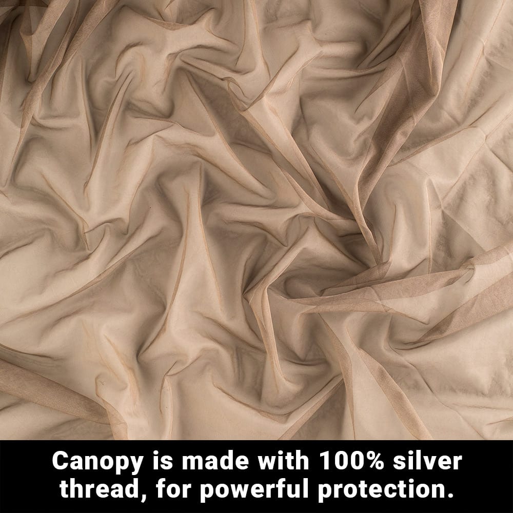 A flat lay close up of a fabric scrunched with a text below, canopy is made with 100 percent silver thread, for powerful protection.