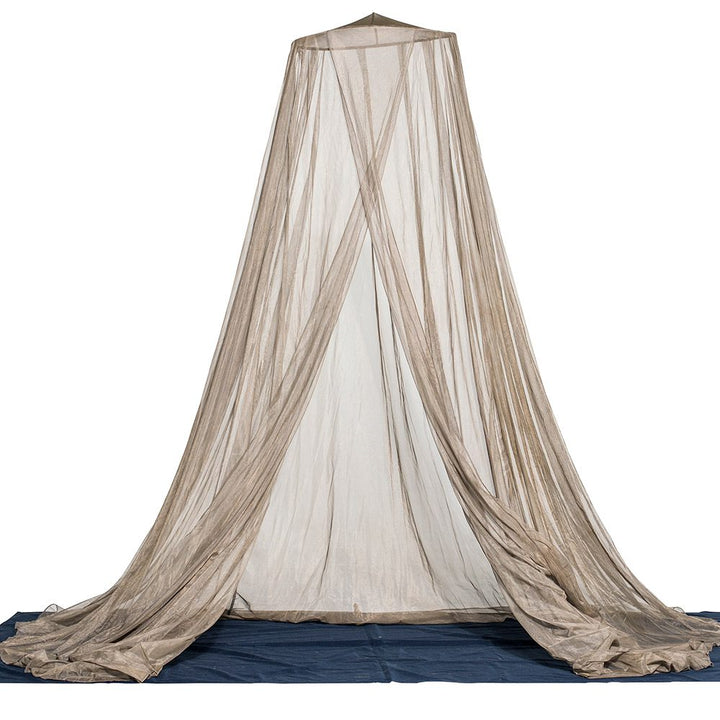 A picture of the full draped fabric hanging, open in between the overlapping slit, with a mat in the floor.